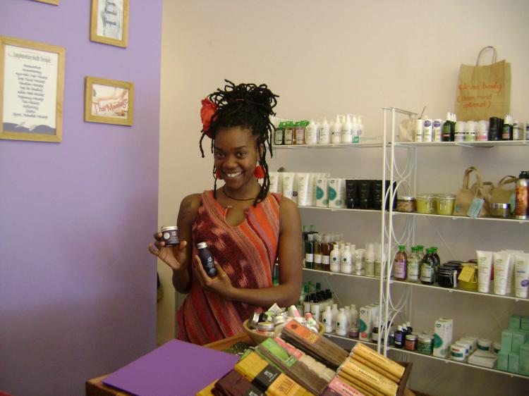 Laurence, one of the therapists at Waterloo Body Station displaying some of the shop's entirely British-made products