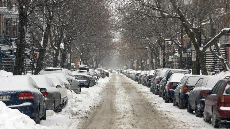 A street in the Plateau Mont-Royal district of Montreal is covered with snow in March 2008. By mid-March last winter Montreal had accumulated some 350 centimetres (11.5 feet) of snow. (David Boily/AFP/Getty Images)