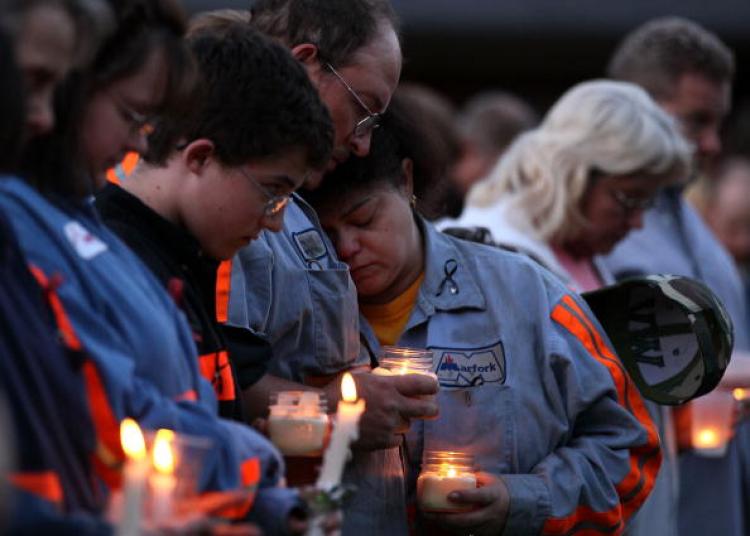 West Virginia Mine Tragedy: People participate in a candlelight vigil to honor the coal miners that were killed, on April 10 in Montocal, West Virginia. On April 5, a methane gas explosion killed 29 coal miners at the Massey Energy Company's Upper Big Bra (Mark Wilson/Getty Images)