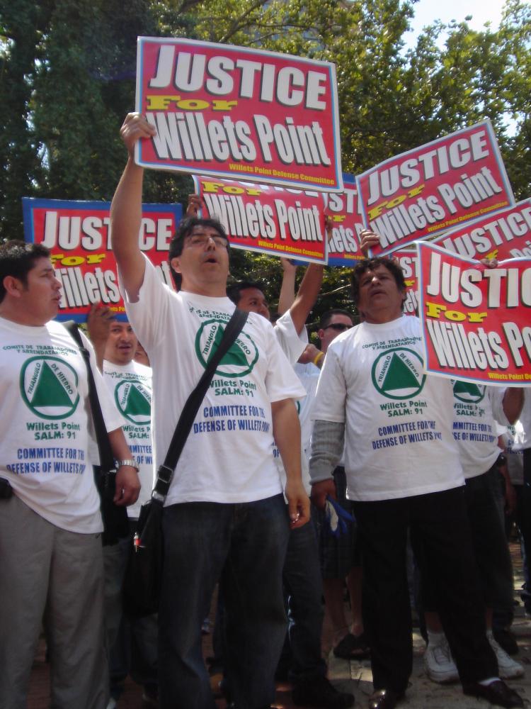 CONFRONTATION: The chants of small business owners and workers from Willets Point rallying against Mayor Bloomberg's redevelopment proposal drown out a press conference at Washington Square Park.  ((CHERYL WU/EPOCH TIMES))