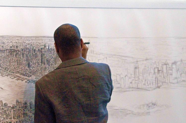 DRAWING THE CITY: Autistic artist Stephen Wiltshire draws Manhattan from memory at the Pratt Institute, in Brooklyn.  (Dan Skorbach/The Epoch Times)