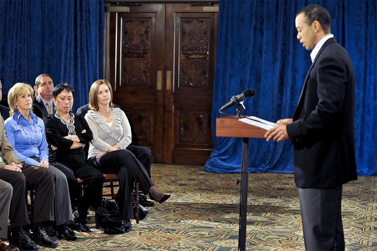 Tiger Woods makes a statement as his mother, Kultida Woods (3rd-L) listens, from the Sunset Room on the second floor of the TPC Sawgrass, home of the PGA Tour on February 19, 2010 in Ponte Vedra Beach, Florida. (Lori Moffett/Getty Images)