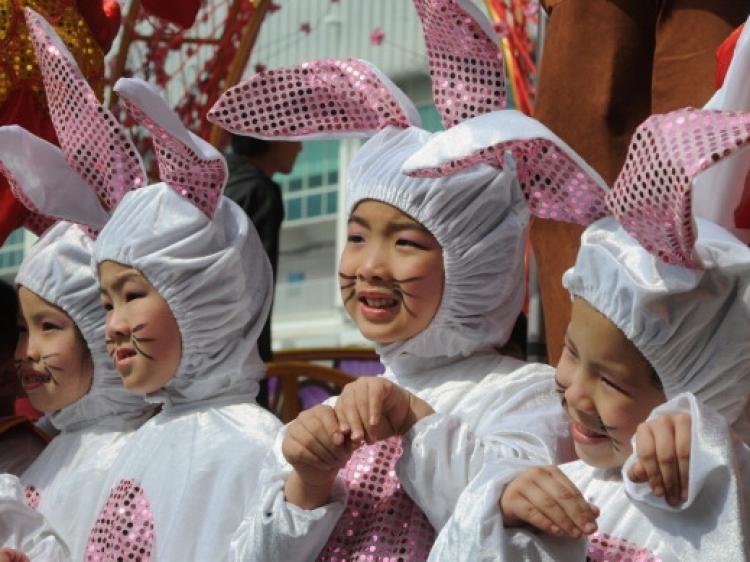 YEAR OF THE RABBIT: Children take part in an early Chinese New Year performance at a shopping mall in Hong Kong on Jan. 25. 2011 marks the coming Year of the Rabbit according to the Chinese Lunar Calendar. (Mike Clarke/AFP/Getty Images)