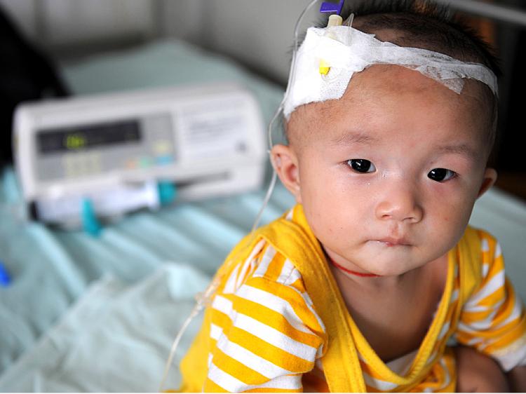 A baby who suffers from kidney stones after drinking tainted milk powder, gets IV treatment at the Chengdu Children's Hospital in Chengdu, China.   (China Photos/Getty Images)