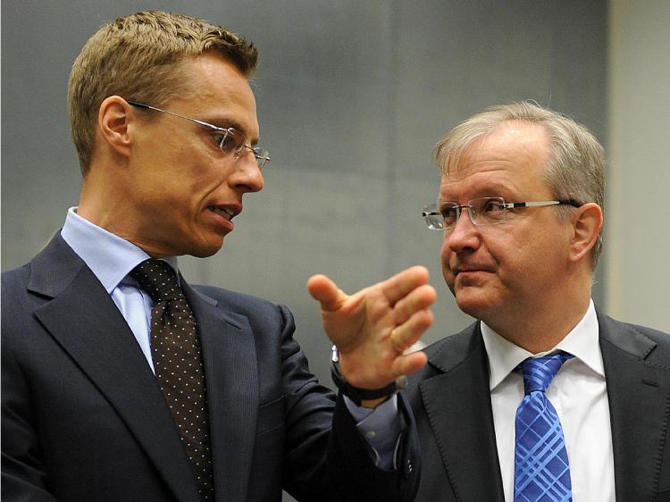 Finnish Foreign Minister Alexander Stubb (L) speaks with EU enlargement commissioner Olli Rehn before an EU General Affairs Council meeting on April 27, 2009 in Luxembourg. (John Thys/AFP/Getty Images)