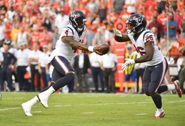 Houston Texans quarterback Deshaun Watson hands off to running back Lamar Miller during the first half against the Kansas City Chiefs.