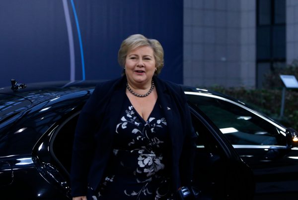 Norway's Prime Minister Erna Solberg gets out of a car