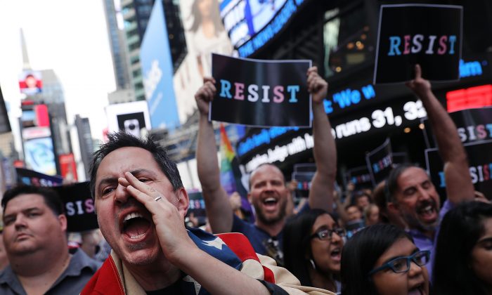 Dozens of anti-Trump protesters gather in Times Square, New York, on July 26, 2017. Commentators have said that the tactics used by the Anti-Trump Resistance have started to embody the very things they are protesting about. (Spencer Platt/Getty Images)