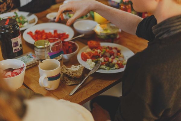 man sitting at table eating