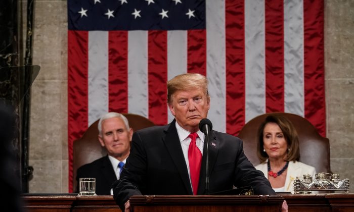 President Donald Trump, with Speaker Nancy Pelosi and Vice President Mike Pence looking on, delivers the State of the Union address in the chamber of the U.S. House of Representatives at the U.S. Capitol Building in Washington on Feb. 5, 2019. (Doug Mills-Pool/Getty Images)