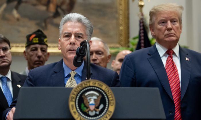 Frank Larkin, veteran and former Senate Sergeant at Arms, speaks about his son Ryan, a Navy Seal who committed suicide, alongside President Donald Trump prior to Trump's signing of an executive order to help prevent veteran suicide, at the White House in Washington, on March 5, 2019. (SAUL LOEB/AFP/Getty Images)