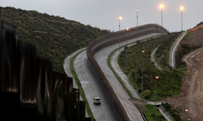A Border Patrol unit near a section of reinforced US-Mexico border fence, on Feb. 14, 2019, from Tijuana, Baja California State, Mexico.(Guillermo Arias/AFP/Getty Images)