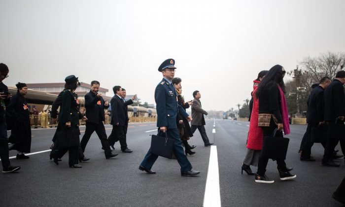 Delegates arrive at the second Plenary Meeting of the second session of the Chinese People's Political Consultative Conference in Beijing's Great Hall of the People March 9. (Fred Dufour/AFP/Getty Images)