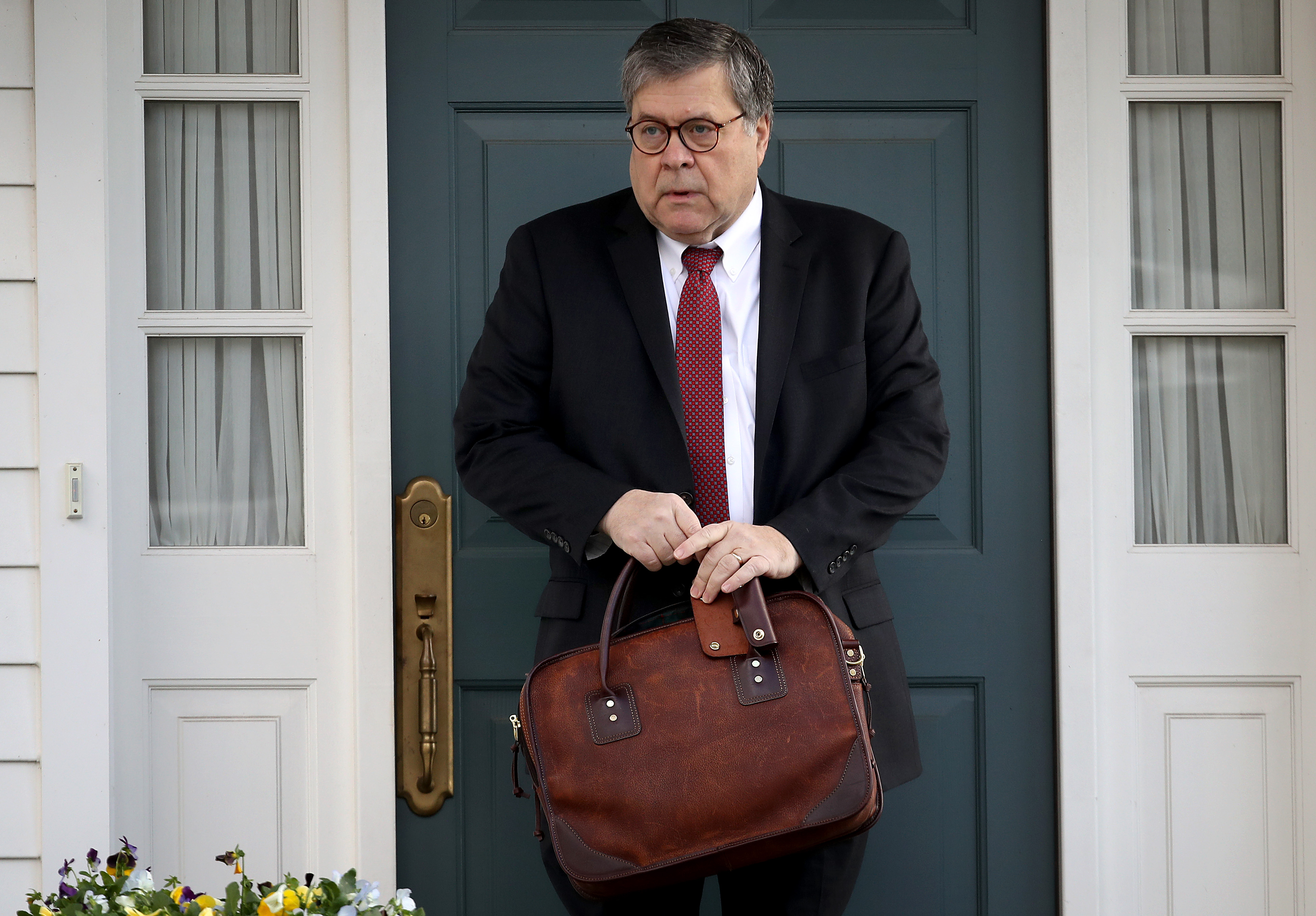 Attorney General William Barr departs his home in McLean