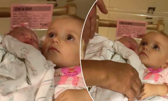 Big Sister Refuses to Let Go of Newborn Baby, Shakes Her Head When Anyone Gets Near