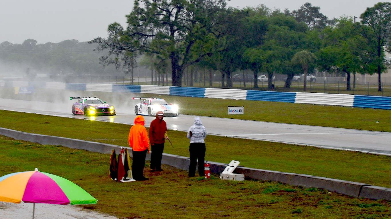 Corner workers endure the rain.