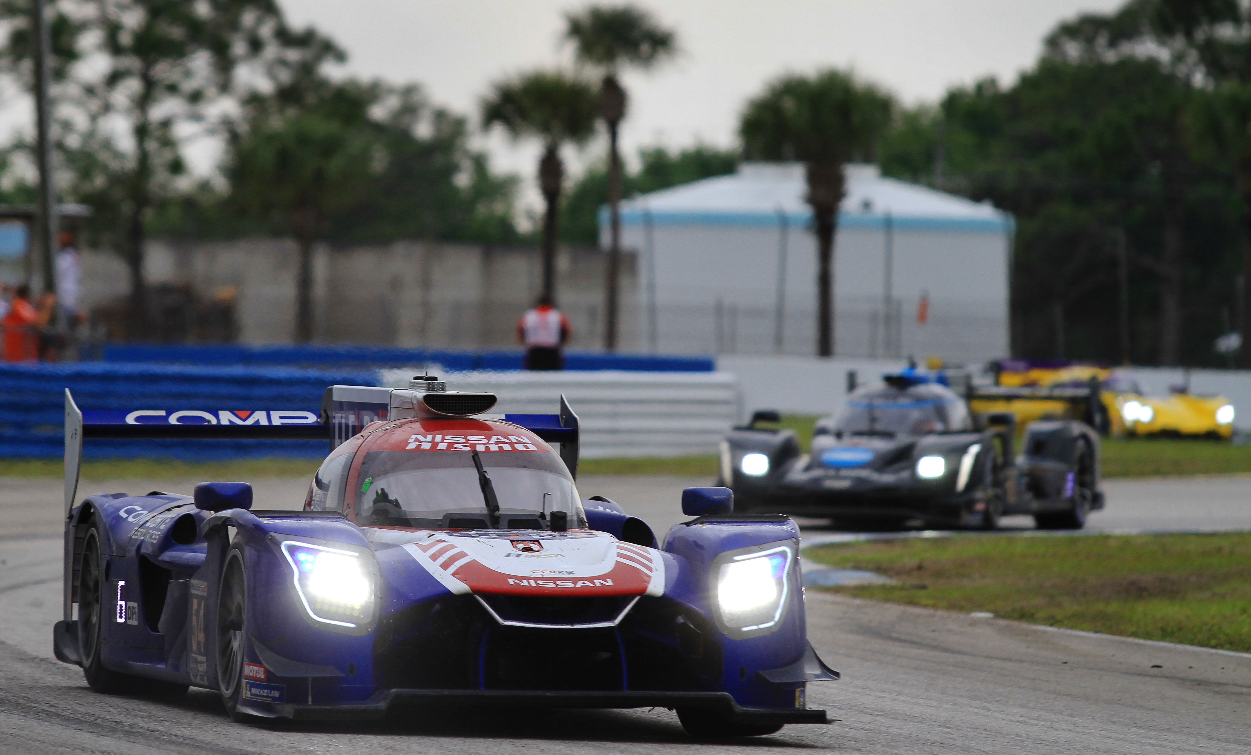 The #54 Core Nissan DPi negotiates Turn 11.