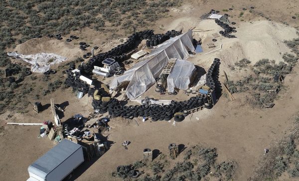 A ramshackle compound in the desert area of Amalia, N.M., on Aug. 10, 2018. A similar compound has been discovered in Alabama with links to the same group of accused terrorists. (Brian Skoloff/File via AP)