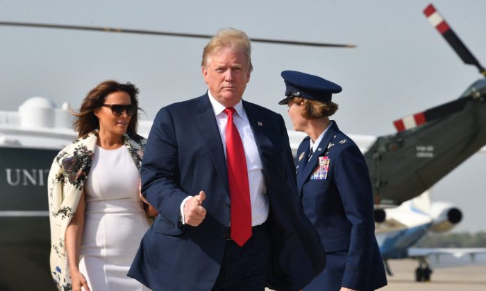 President Donald Trump and First Lady Melania Trump arrive at Andrews Air Force Base in Maryland prior to boarding Air Force One for departure to Florida, on April 18, 2019. (Nicholas Kamm/AFP/Getty Images)