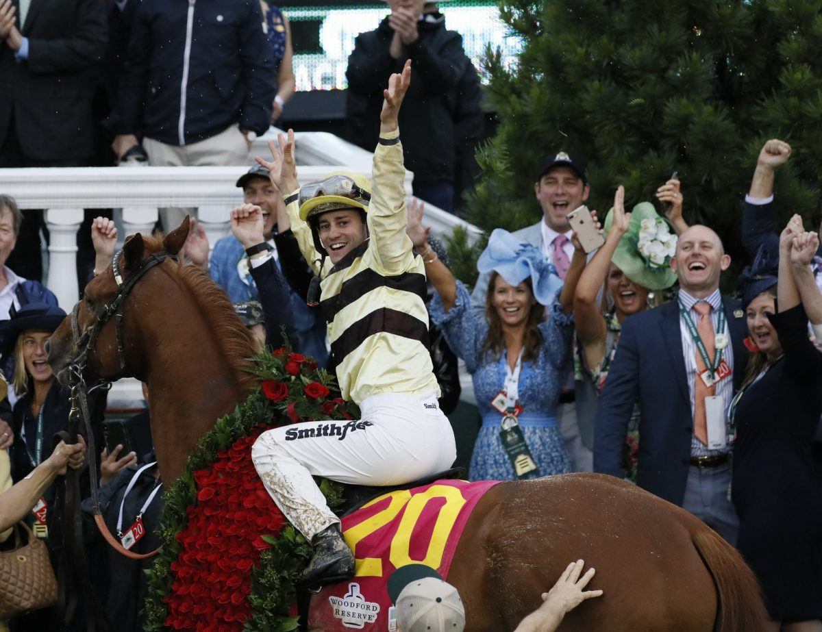 Flavien Prat celebrates after riding Country House to first place