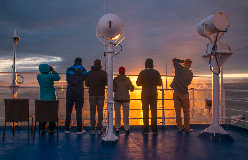 passengers looking at sun