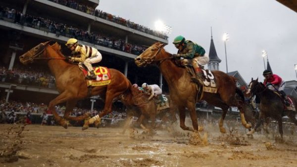 Flavien Prat rides Country House (L) to the finish line during the 145th running of the Kentucky Derby horse race
