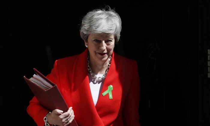 Britain's Prime Minister Theresa May leaves 10 Downing Street for her weekly Prime Minister's Questions in the House of Commons in London on May 15, 2019. (Alastair Grant/Photo via AP)