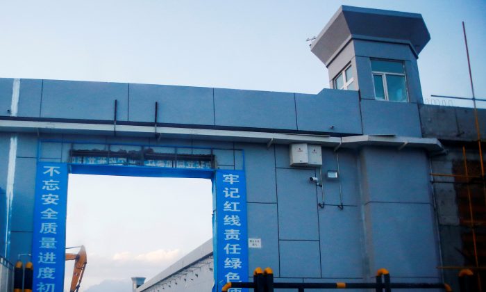 FILE PHOTO: A gate of what is officially known as a vocational skills education center under construction in Dabancheng, in Xinjiang Uighur Autonomous Region, China, on Sept. 4, 2018. (Reuters/Thomas Peter/File Photo)