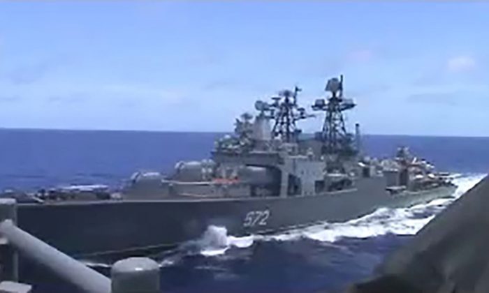 A screen grab from video shows the Russian naval destroyer Udaloy making what the U.S. Navy describes as an unsafe maneuver against the Ticonderoga-class guided-missile cruiser USS Chancellorsville in the Philippine Sea on June 7, 2019. (U.S. Navy/Handout via Reuters)