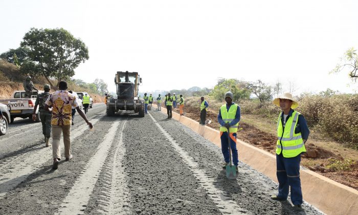 A road under construction with ballast stone from a quarry set up by a Chinese state-owned company. Residents of Yoko—the town near which the quarry is set up—report that their homes is being damaged due to vibrations caused by the quarry. (Amindeh Blaise Atabong for The Epoch Times)