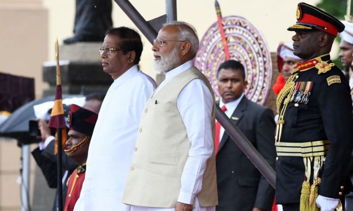 Indian Prime Minister Narendra Modi (C) and Sri Lankan President Maithripala Sirisena (L) attend a welcoming ceremony for Modi at the Presidential Secretariat, in Colombo on June 9, 2019. (Lakruwan Wanniarachchi/AFP/Getty Images)