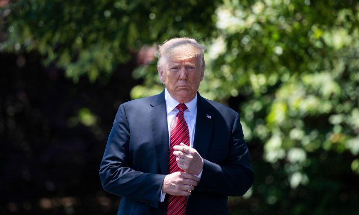President Donald Trump walks out of the Oval Office to speak with reporters at the White House on June 11, 2019. (Jim Watson/AFP/Getty Images)