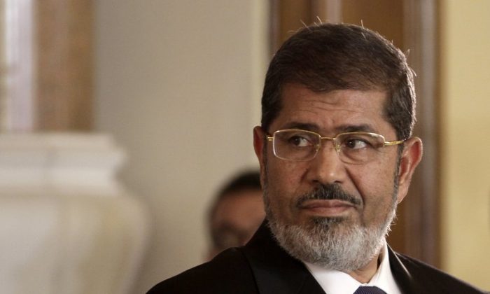 Egyptian President Mohammed Morsi holds a news conference with Tunisian President Moncef Marzouki, at the Presidential palace in Cairo, Egypt on July 13, 2012. (Maya Alleruzzo/File Photo via AP)