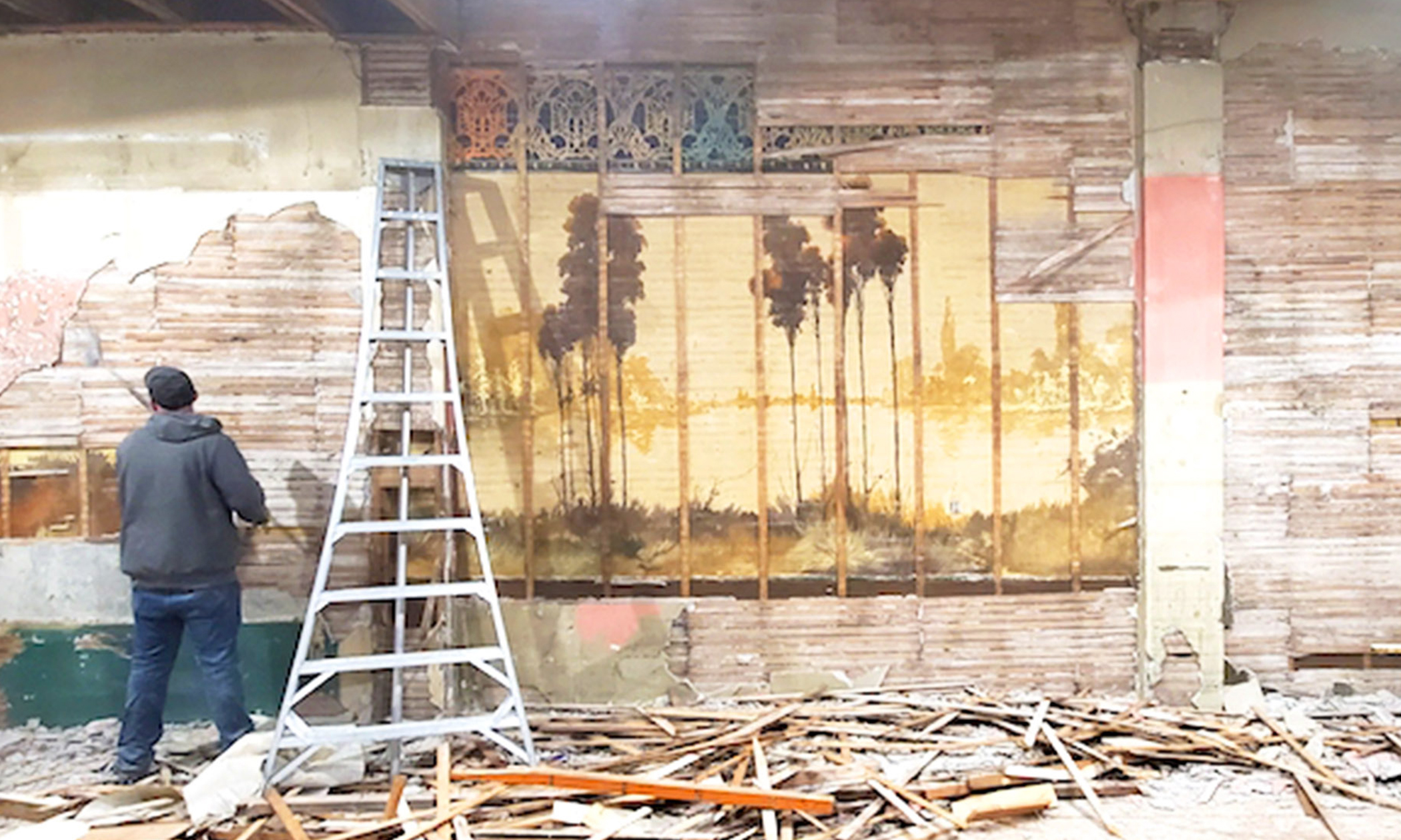 Couple Renovating Dilapidated Old Building Stumble on 60-Foot Century-Old Murals Hidden Behind the Walls