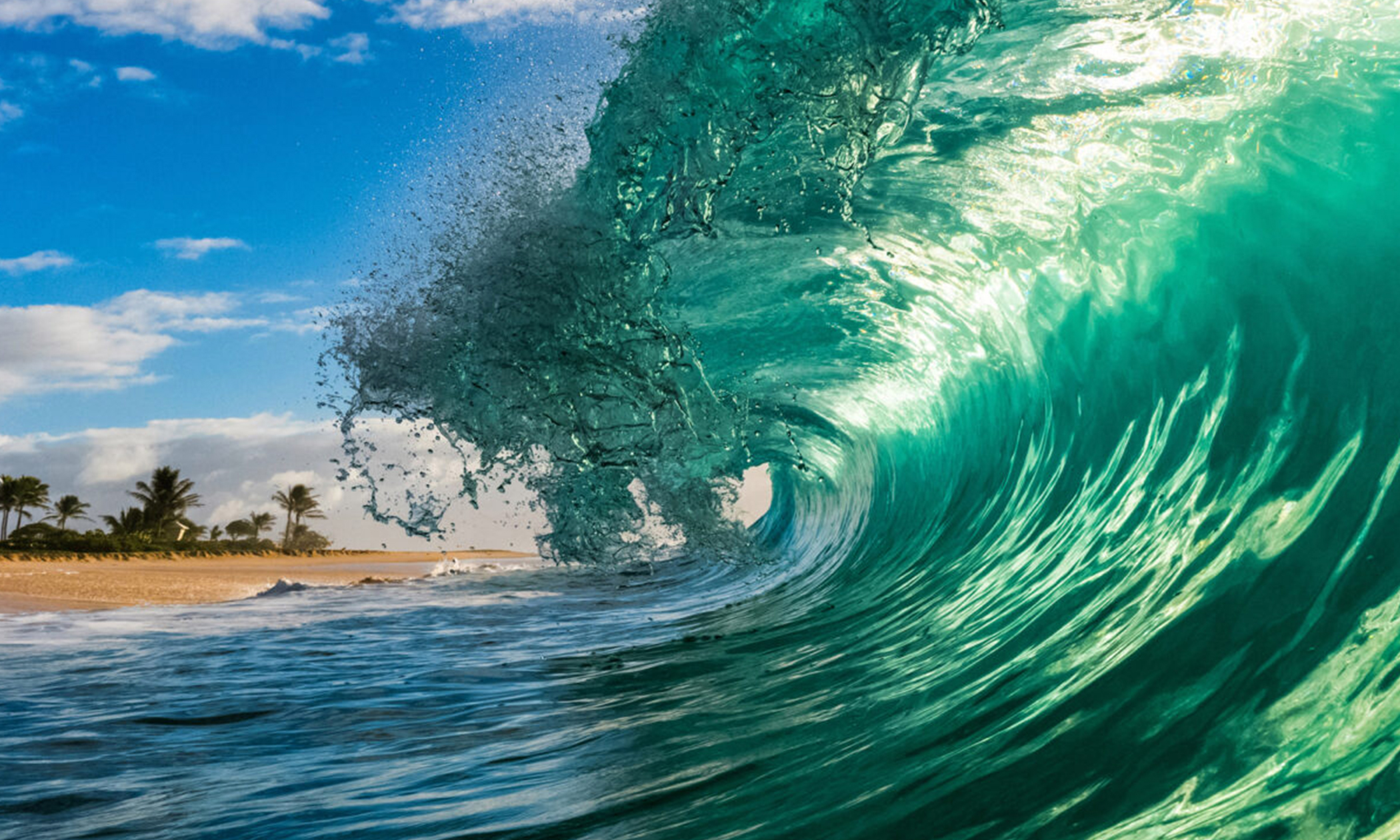 Wave Photographer Captures Glasslike Insides of Surf Waves That Look Unreal Thru His Lens