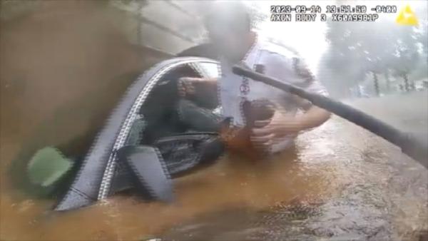 Dramatic Rescue: Police Help Driver Trapped in Deep Floodwaters