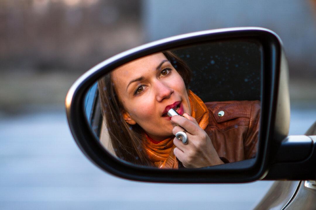 Distraction Skews Actions and Perception Differently