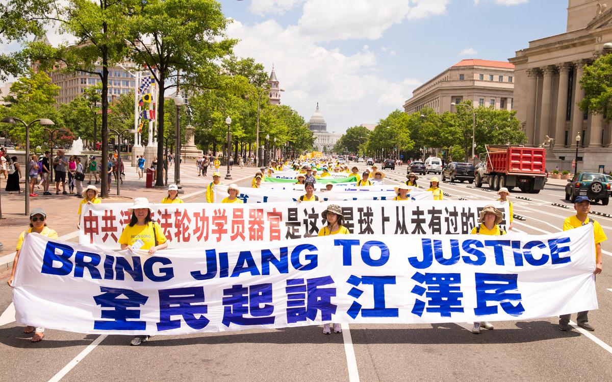 Falun Gong practitioners march in Washington, D.C. on July 14, 2016 calling for Jiang Zemin, the former dictator who instigated the persecution of Falun Gong in China, to be brought to justice. (Larry Dye/The Epoch Times)