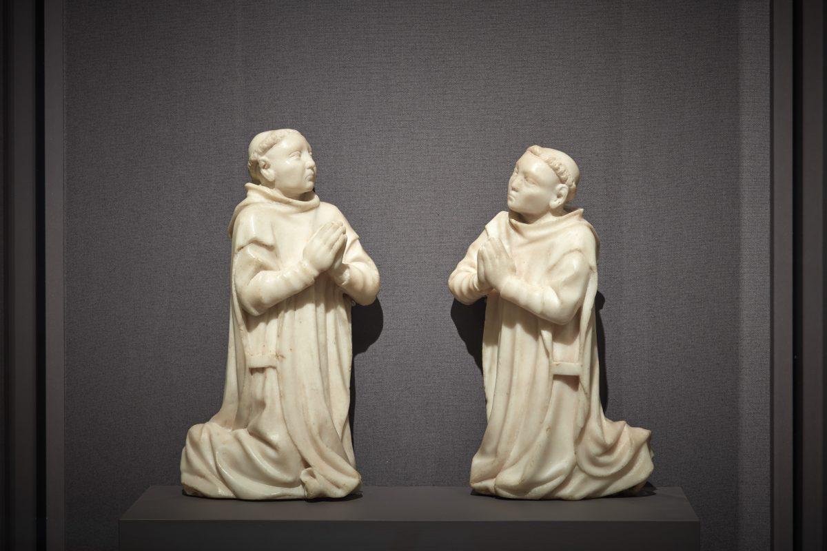 “Kneeling Carthusian Monks,” circa 1380–1400, by unknown artist from Burgundy. Marble<br/>(L) 10 1/16 inches by 5 1/2 by 2 5/8 inches; (R) 9 1/2 inches by 5 3/4 inches by 2 15/16 inches. The Cleveland Museum of Art. (The Frick Collection)