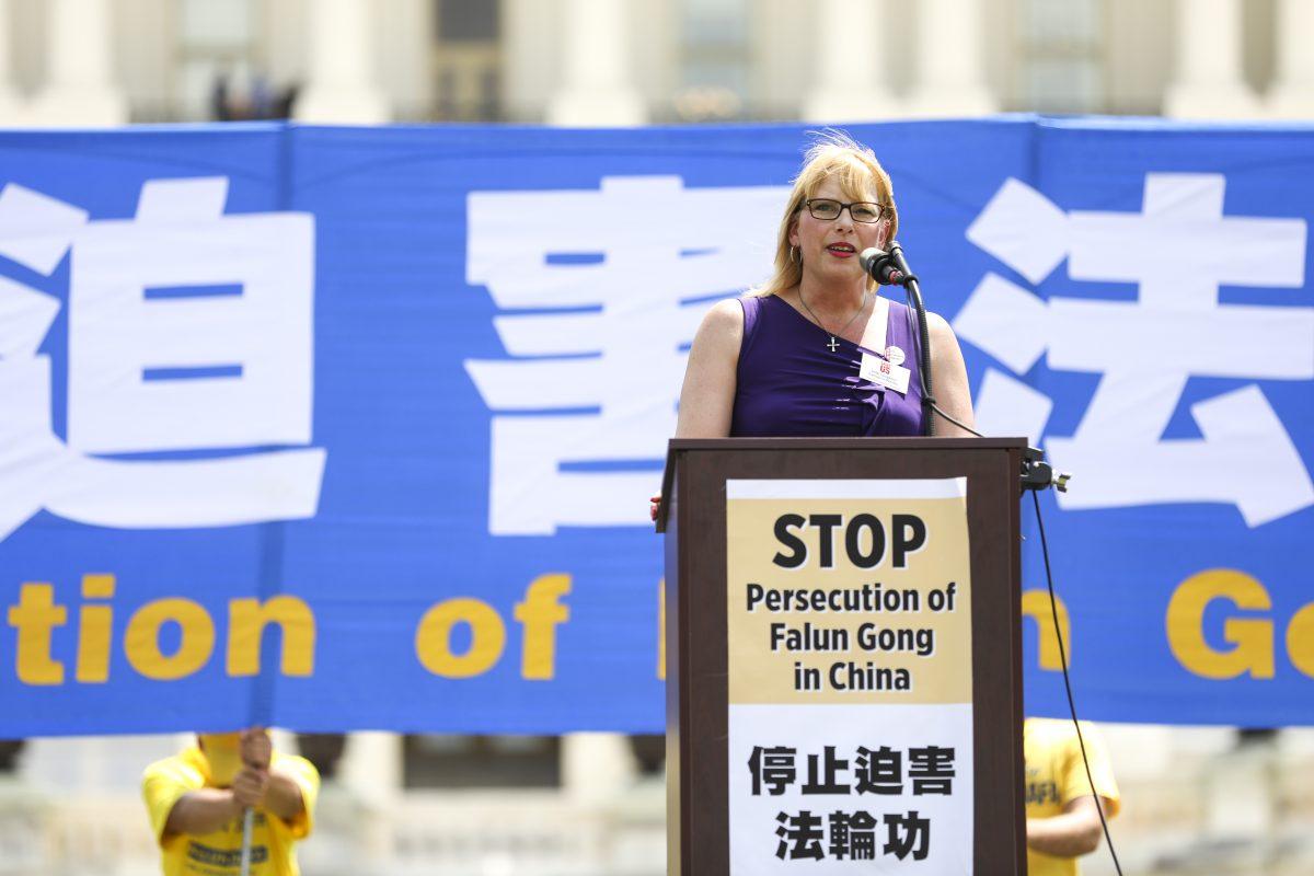 Dede Laugesen, Executive Director at Save the Persecuted Christians, speaks at a rally commemorating the 20th anniversary of the persecution of Falun Gong in China, on the West lawn of Capitol Hill in Washington on July 18, 2019. (Samira Bouaou/The Epoch Times)