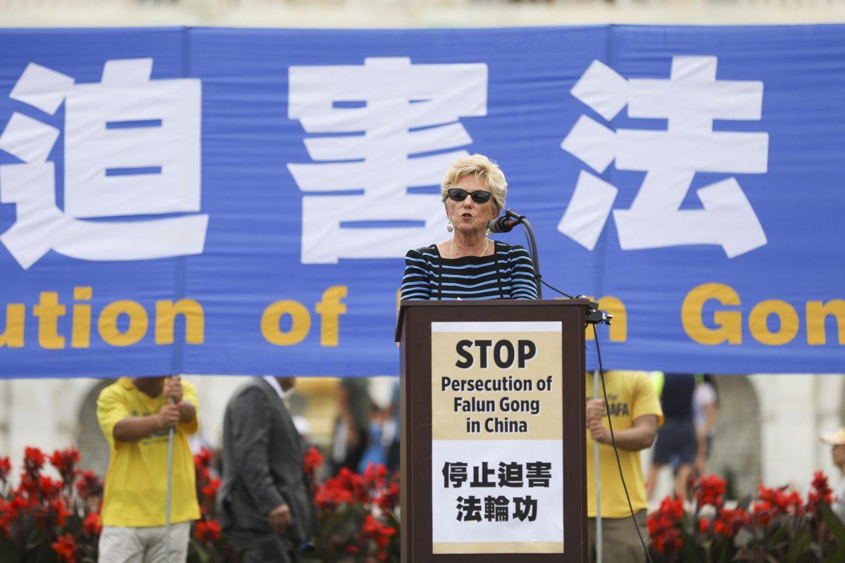 Gayle Manchin, Vice Chairman of the United States Commission on International Religious Freedom, speaks at a rally commemorating the 20th anniversary of the persecution of Falun Gong in China, on the West lawn of Capitol Hill in Washington on July 18, 2019. (Samira Bouaou/The Epoch Times)