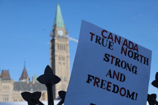 A protest sign near Parliament Hill in Ottawa on Feb. 13, 2022. (Richard Moore/The Epoch Times)