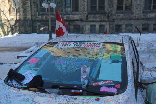 A signature-covered car in the downtown area of Ottawa on Feb. 13, 2022. (Richard Moore/The Epoch Times)