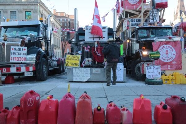 Gas containers are lined up at the center of the encampment in Wellington St, Ottawa, on Feb. 14, 2022. (Richard Moore/The Epoch Times)