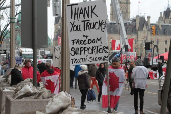 A sign at the site of the trucker protest in downtown Ottawa on Feb. 11, 2022. (Richard Moore/The Epoch Times)
