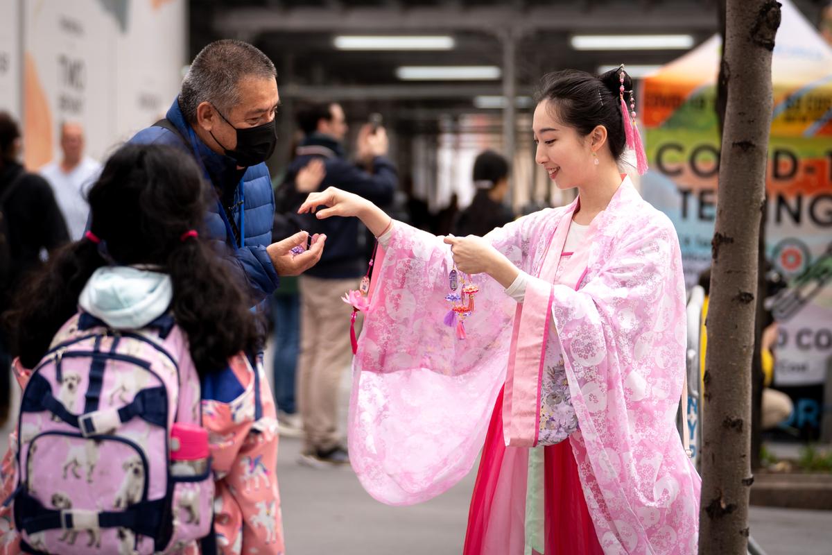Falun Gong practitioners take part in a parade marking the 30th anniversary of its introduction to the public, in Manhattan, New York, on May 13, 2022. (Samira Bouaou/The Epoch Times)