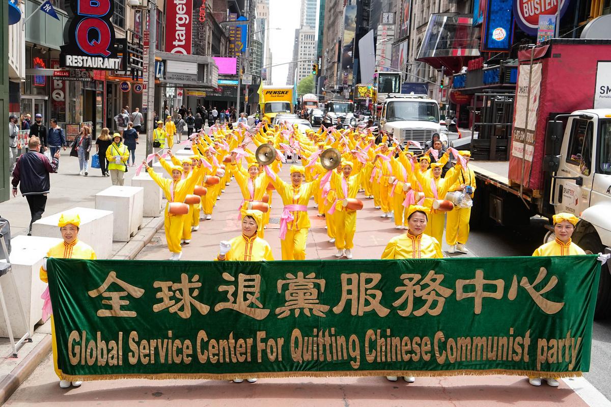 Falun Gong practitioners take part in a parade marking the 30th anniversary of its introduction to the public, in Manhattan, New York, on May 13, 2022. (Larry Dye/The Epoch Times)