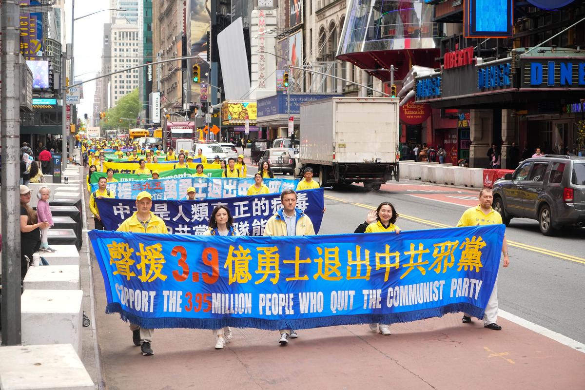 Falun Gong practitioners take part in a parade marking the 30th anniversary of its introduction to the public, in Manhattan, New York, on May 13, 2022. (Larry Dye/The Epoch Times)
