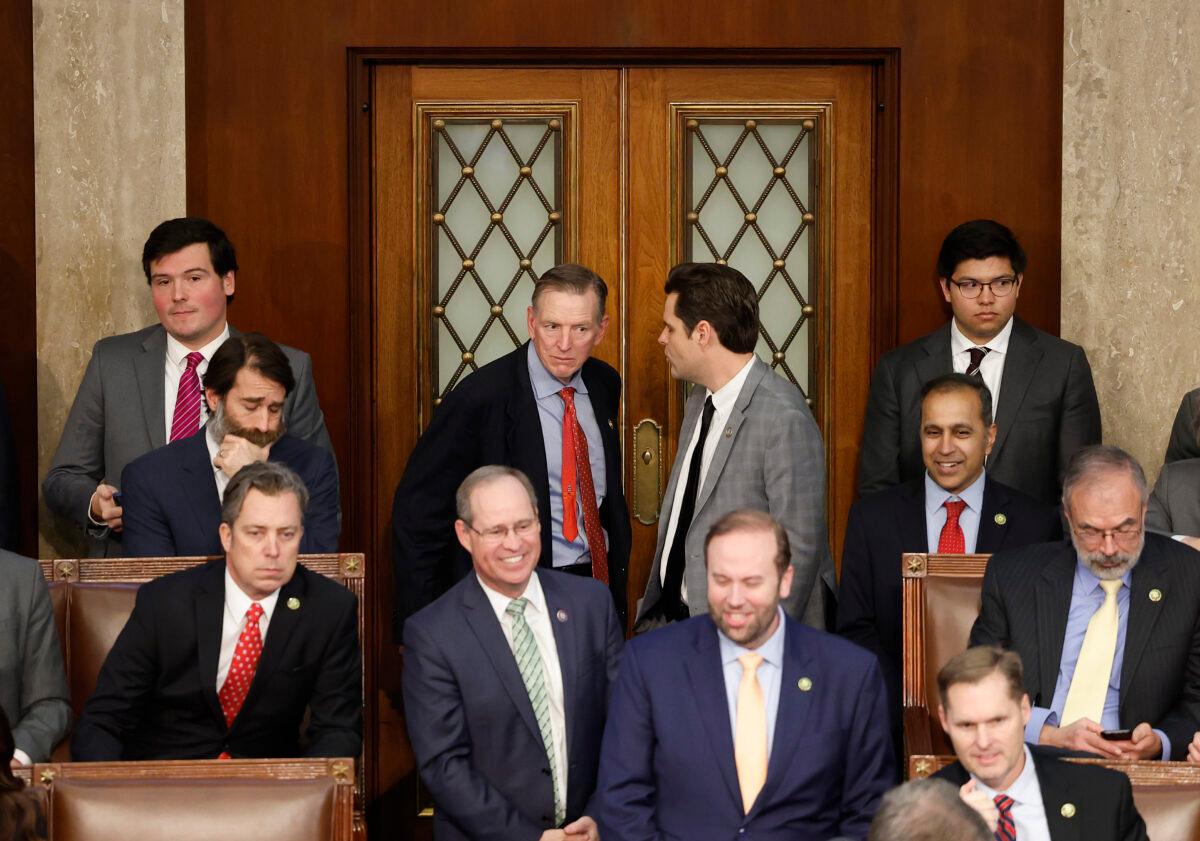 U.S. Rep.-elect Matt Gaetz (R-Fla.) (R) talks to Rep.-elect Paul Gosar (R-Ariz.) in the House Chamber during the fourth day of elections for Speaker of the House at the U.S. Capitol Building in Washington on Jan. 6, 2023. (Anna Moneymaker/Getty Images)