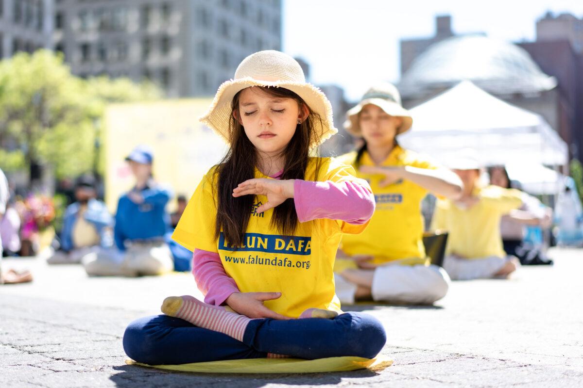 Falun Gong practitioners celebrate World Falun Dafa Day in New York City on May 7, 2023. (Samira Bouaou/The Epoch Times)